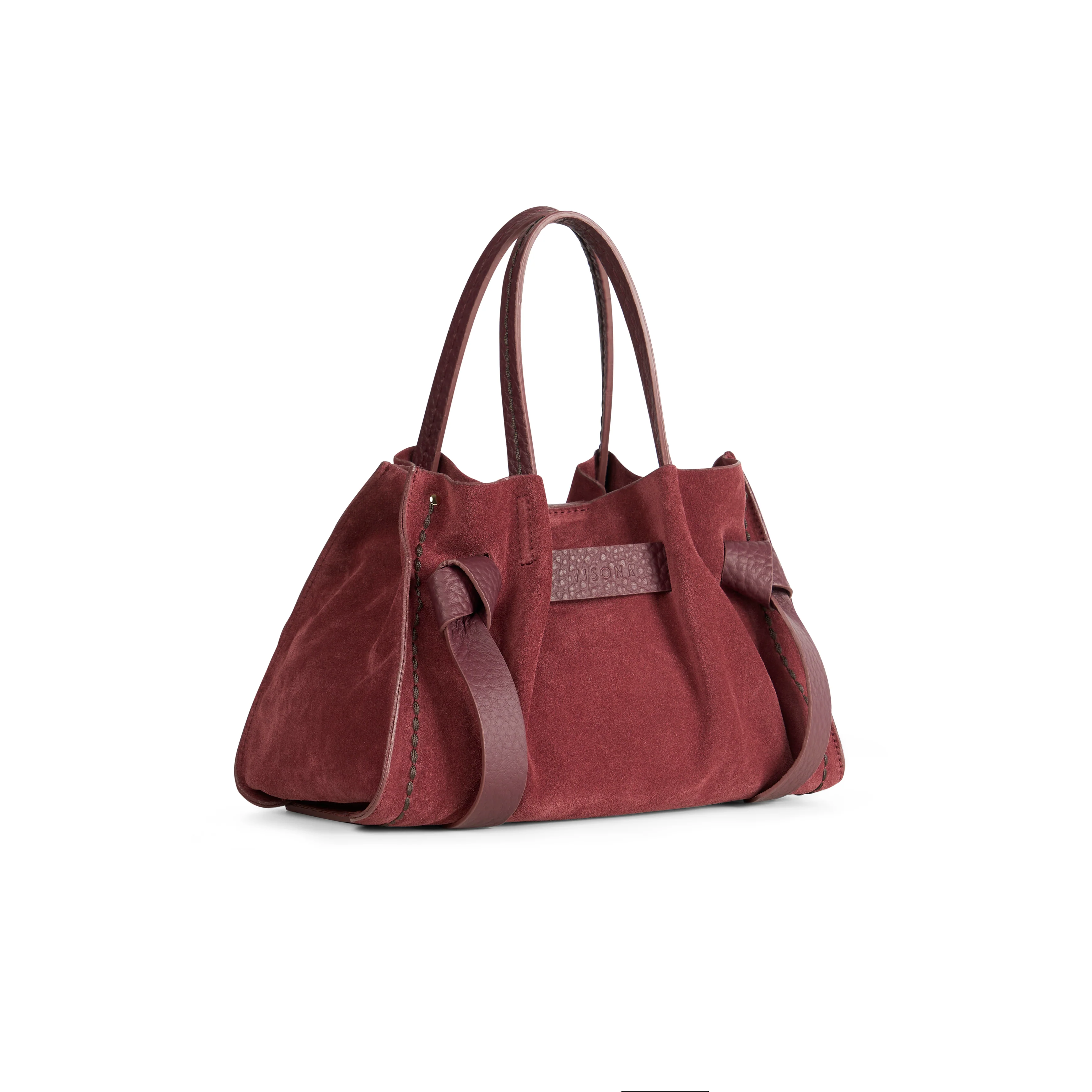 Borsa a mano di piccole-medie dimensioni con fiocchetti in pelle regolabili e tasca interna con zip. 100% Made in Italy.