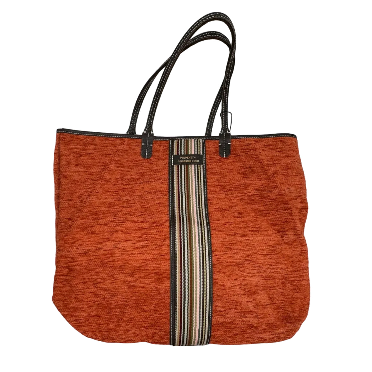 Shopper in tessuto tinta unita, con banda centrale multicolor e classica scritta MANIKOMIO, con borsetta interna staccabile.