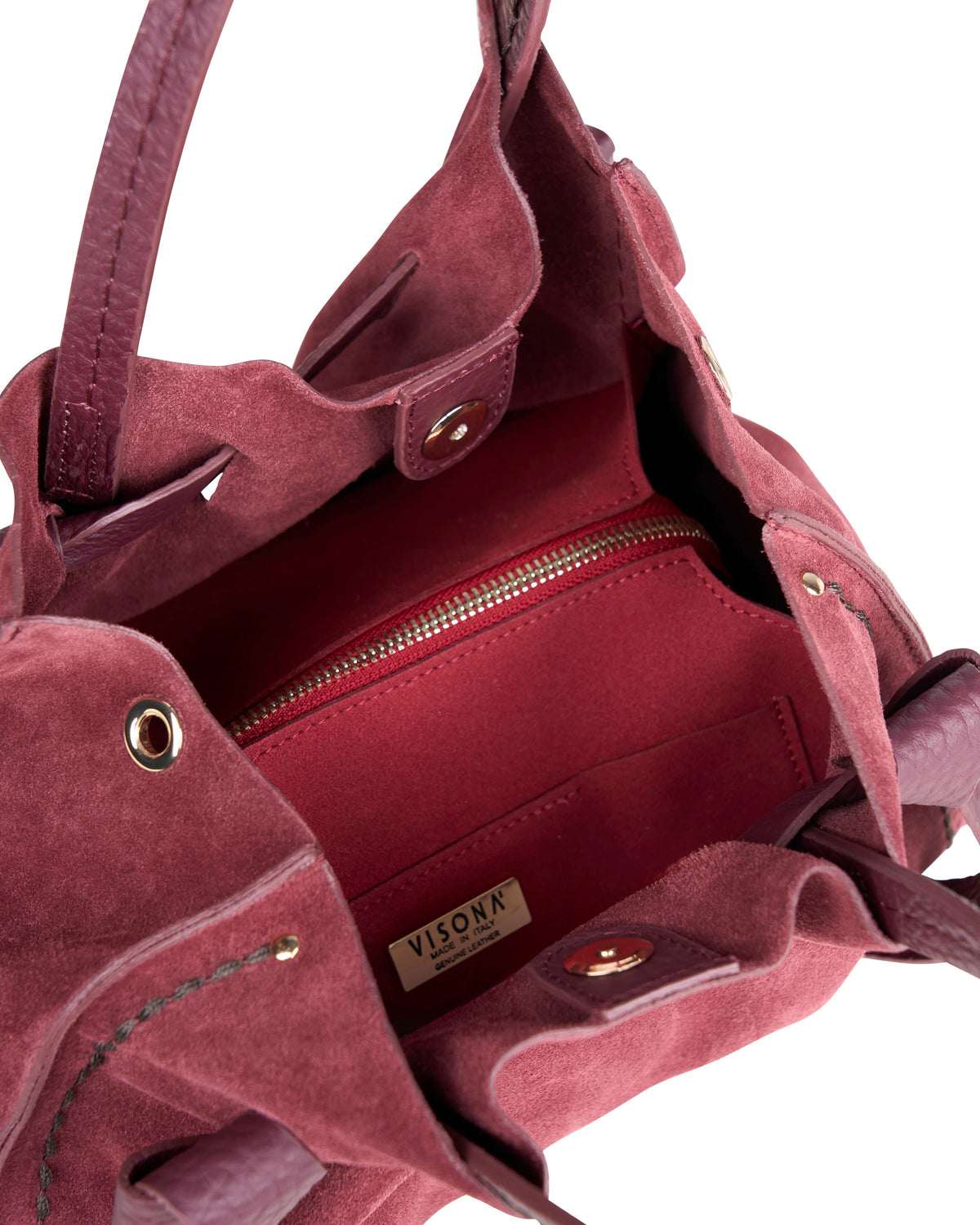 Borsa a mano di piccole-medie dimensioni con fiocchetti in pelle regolabili e tasca interna con zip. 100% Made in Italy.